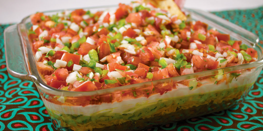 Five Layer Fiesta Dip in casserole dish