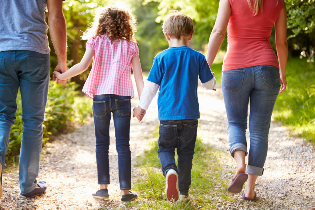 Family walking down trail