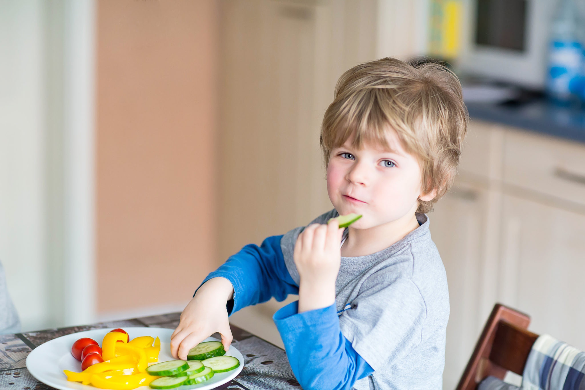 kid eating vegetables