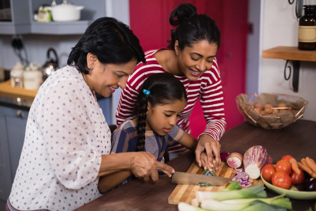 Family cutting vegetables