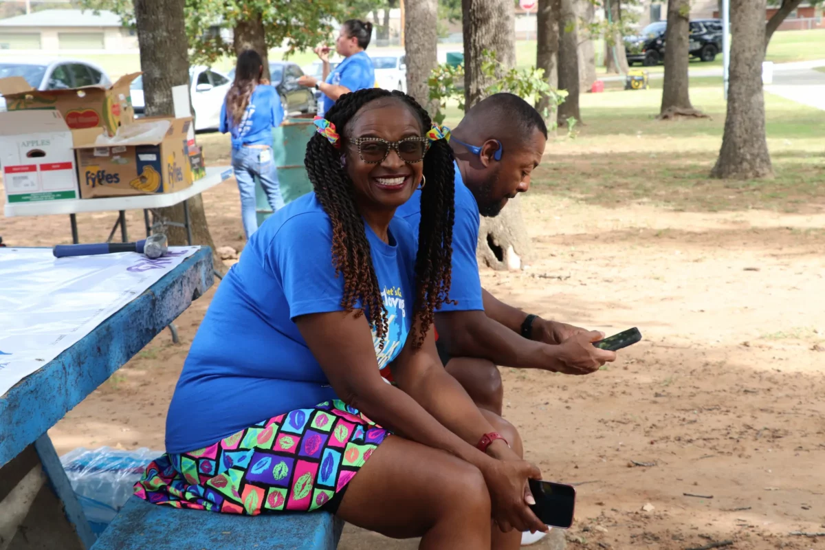 An LGM participant sits on a park bench.